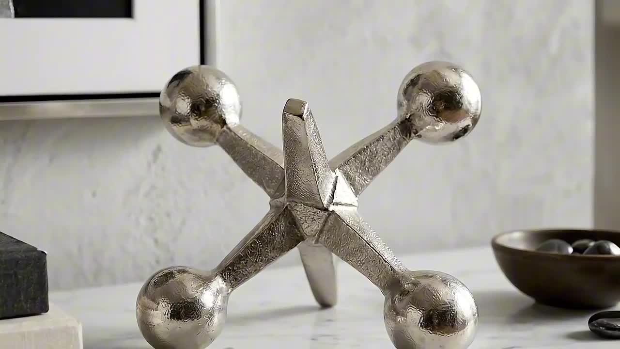 Liv & Skye Silver 7 in. x 5 in. Metal Jacks Abstract Sculpture