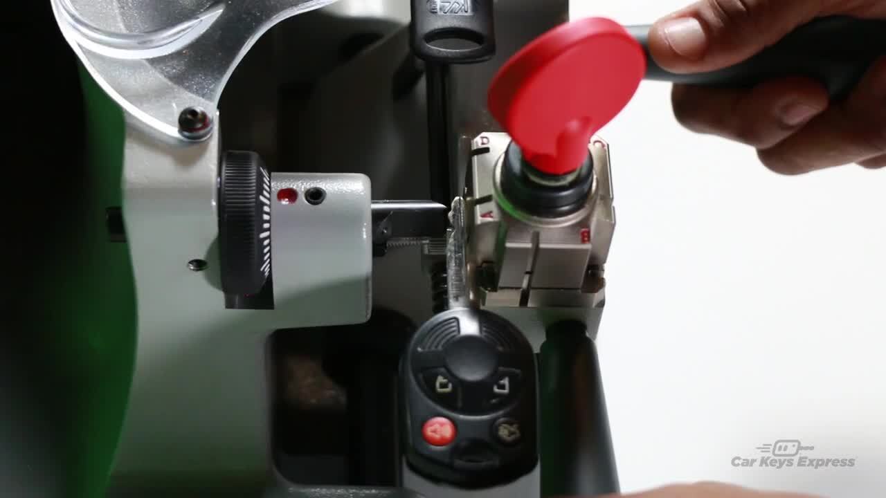 Premium Photo  Hand of locksmith copying car key with key copy  machine.close view of key copying machine with key. duplicate machine make  new key