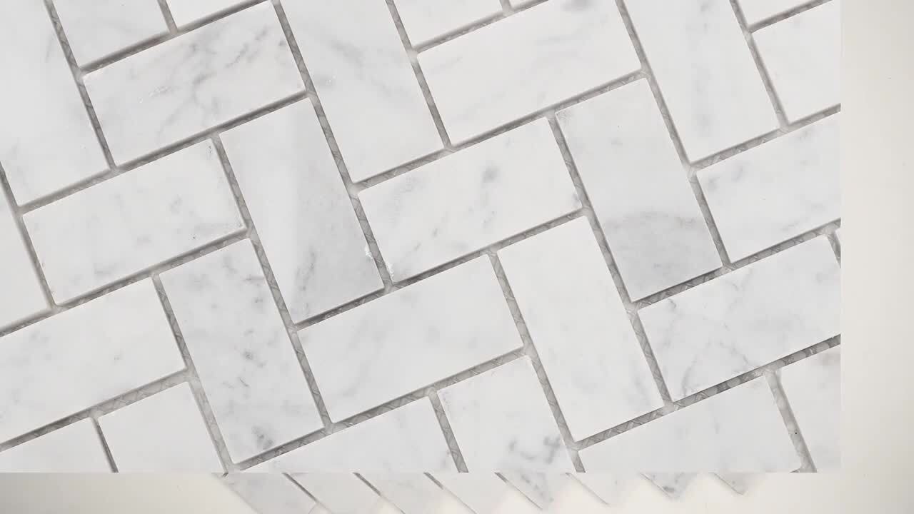 Shower Shelf Detail In Wall Of Herringbone Marble Tiles Stock