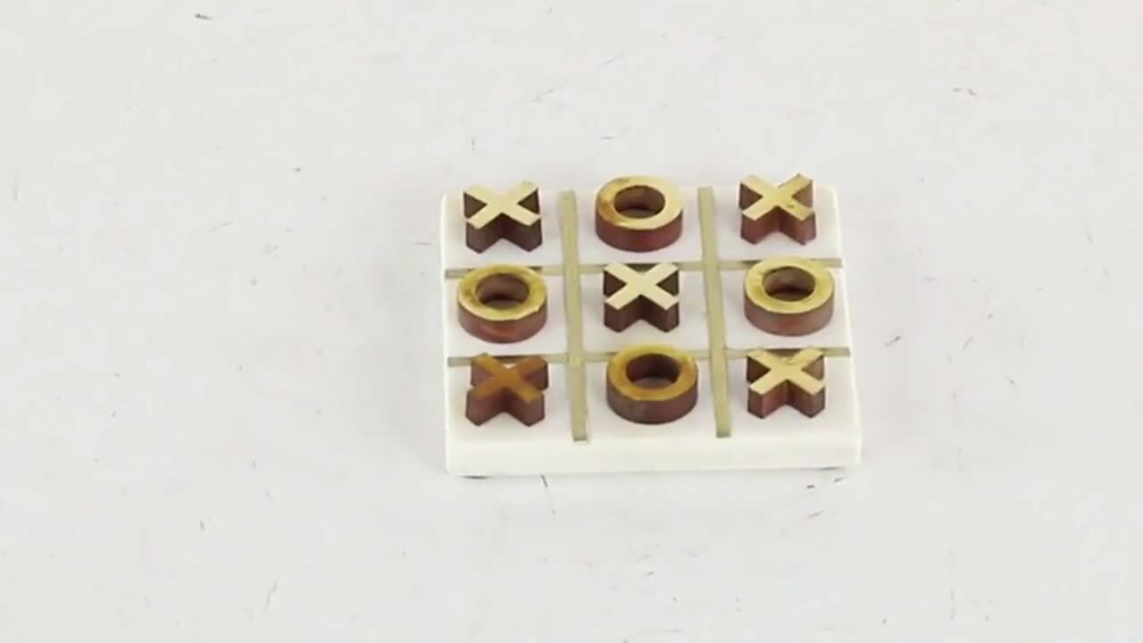 Strategy Tic-Tac-Toe Game With Brass Ornaments In A Wooden Box