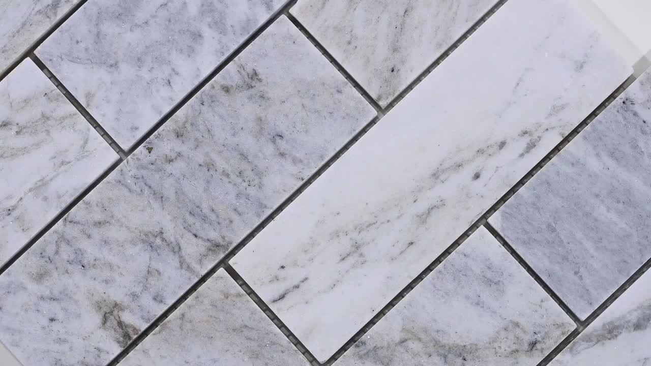 Carrara Classique Brick 11.81 in. x 11.81 in. Honed Marble Wall Tile (9.7 sq. ft./Case) Carrara Classique Brick 11.81 in. x 11.81 in. Honed Marble Wall Tile (9.7 sq. ft./Case)