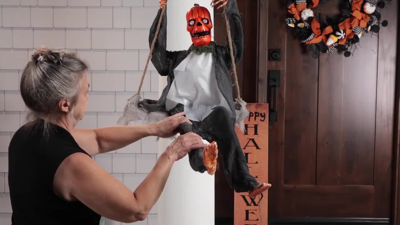 Northlight 30 in. Hanging Play Swing Pumpkin Man Halloween Decoration  32912591, image size:1280x720
