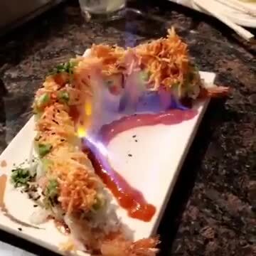Photo of Ijji 2 Sushi & Japanese Steakhouse - Reno, NV, US. Bryan made a special roll with some flames.