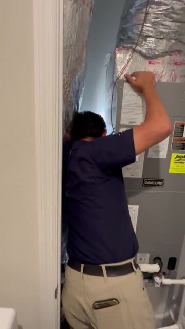 Photo of Gray Home Inspections - Jacksonville, FL, US. HVAC repairman pointing out the defects that Jeff from Gray Home Inspections never caught.