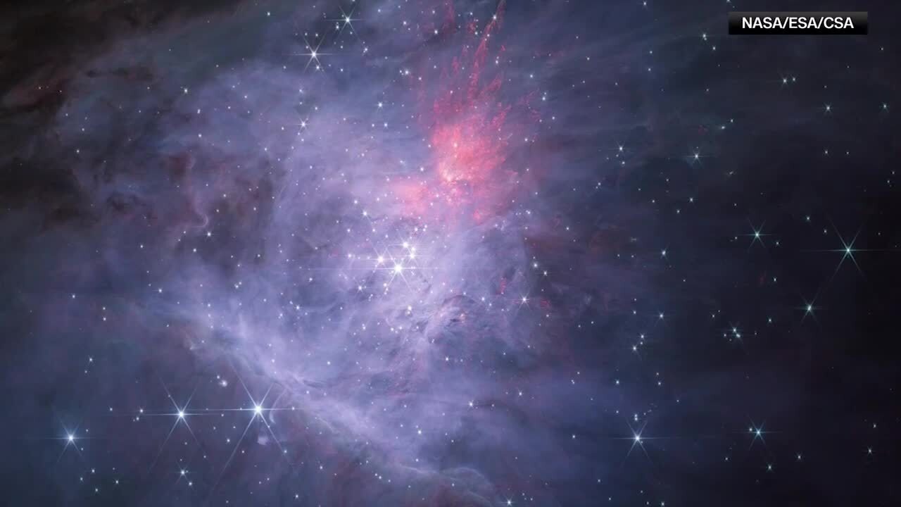 Clouds of Cosmic Dust Glow Near the Orion Nebula