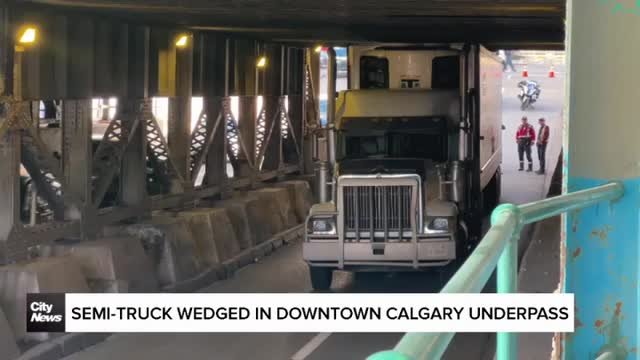 Semi-truck wedged in downtown Calgary underpass