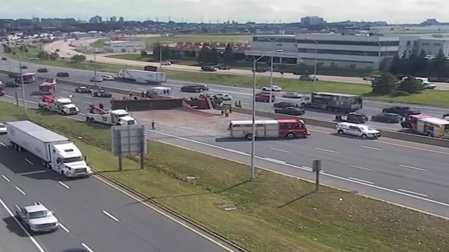 Tracker trailer rolls over on Hwy. 427, shutting down NB lanes