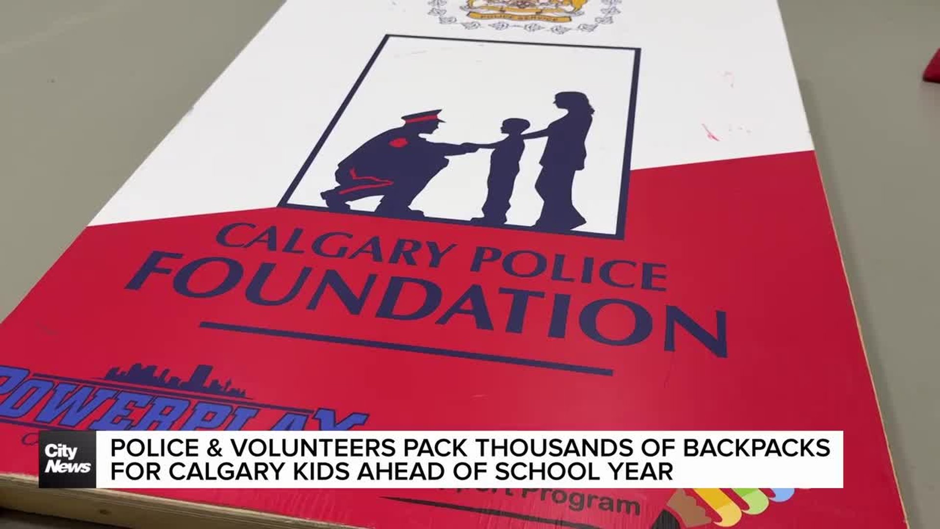 Police and volunteers pack thousands of backpacks for Calgary kids ...