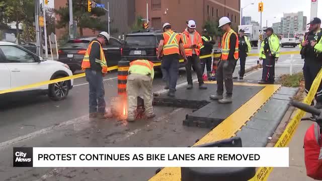 Protest continues as bike lanes are removed