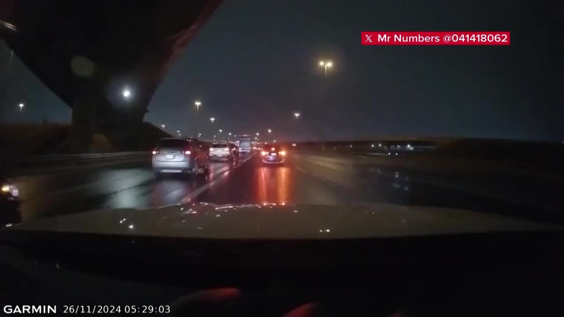 Dashcam footage captures man walking on Highway 401