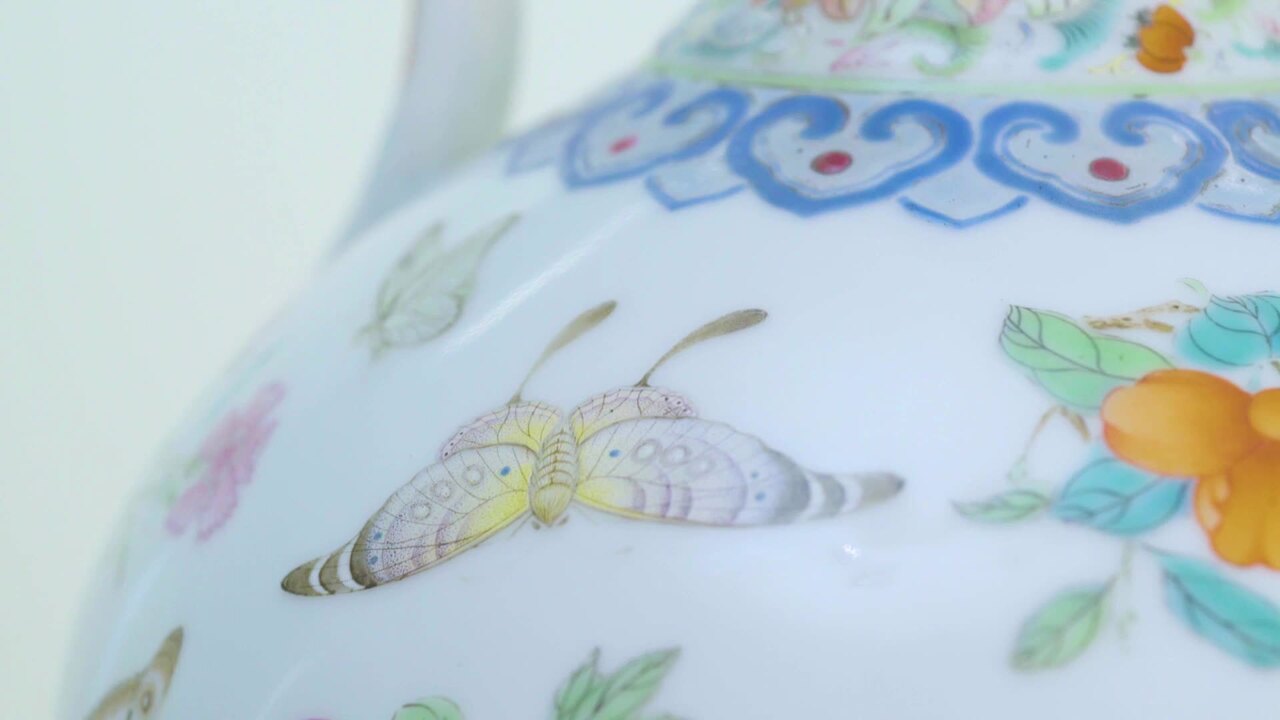 A MAGNIFICENT PAIR OF FAMILLE ROSE 'BUTTERFLY' DOUBLEGOURD VASES