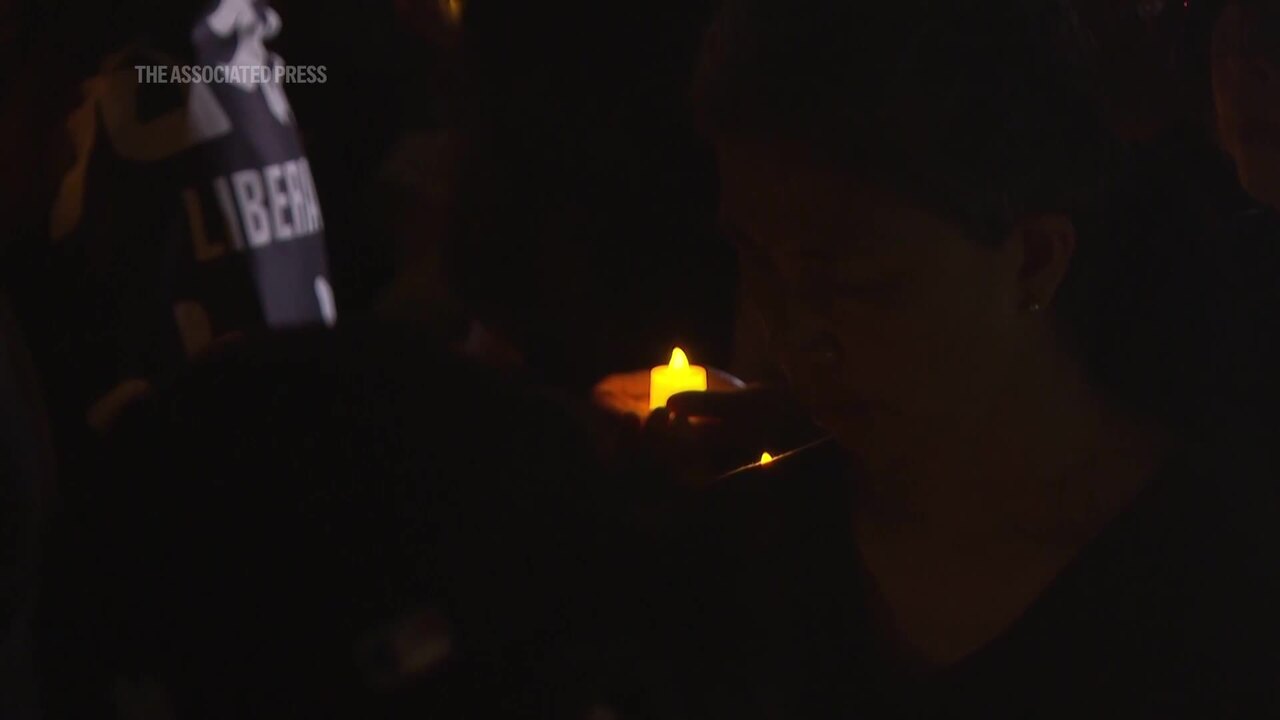 Dozens brave bad weather in Taiwan to honour victims of Tiananmen