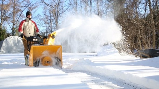 Snow blowers with heated handles