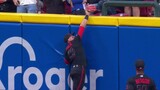 Reds’ Friedl makes leaping catch at wall to rob Trout of home run