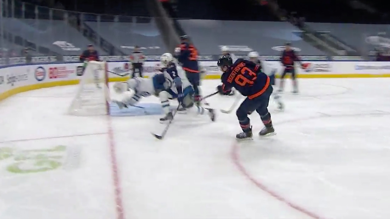 Nugent-Hopkins fires puck into open cage after crisp pass from McDavid