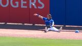 Ponce tips his cap after Barger crashes into outfield wall for catch