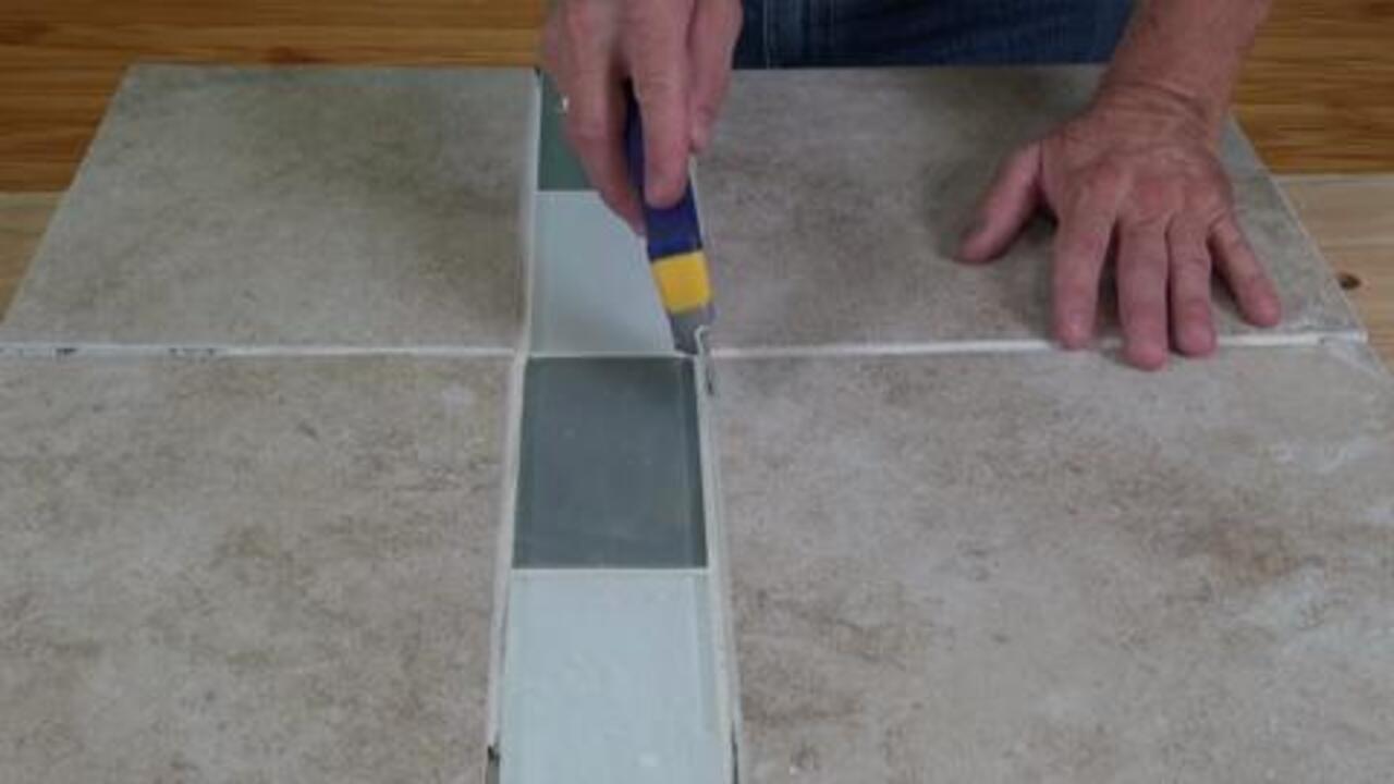 Handheld Grout Saw with Contoured Handle and 2 Blades to Strip, Remove, and Clean Grout Handheld Grout Saw with Contoured Handle and 2 Blades to Strip, Remove, and Clean Grout