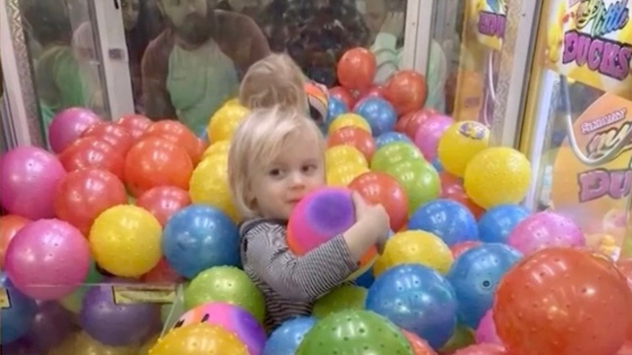 This kid tried to become a real-life claw machine prize