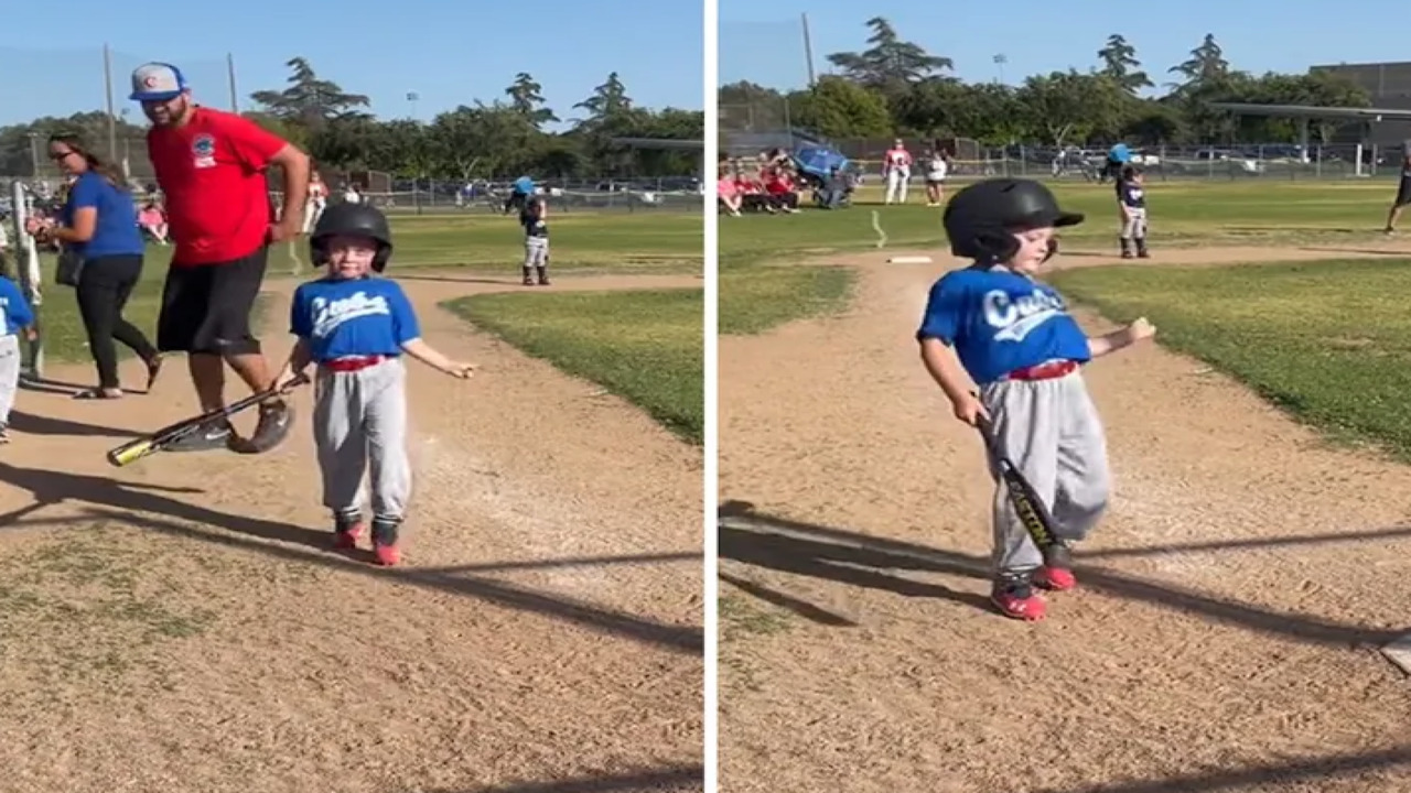 This adorable little league player busts a move