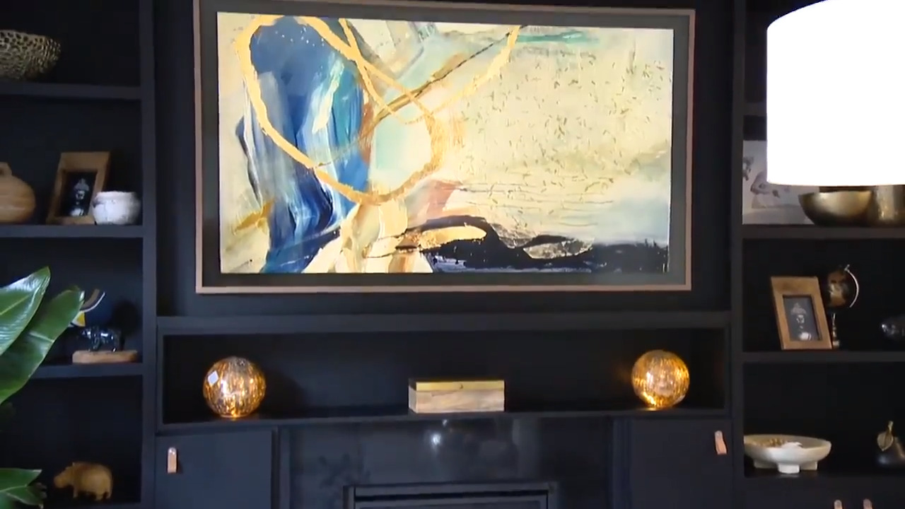 A living room makeover featuring a frame tv that looks like art Video