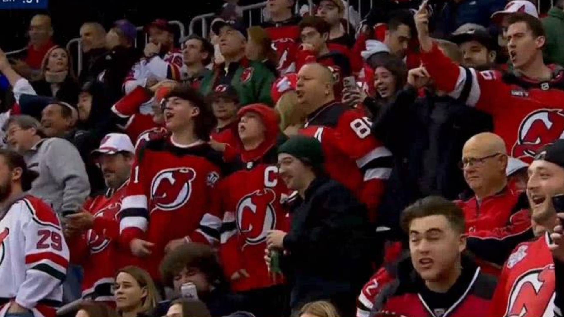 Angry New Jersey Devils fans throw beer onto the ice at Maple Leafs