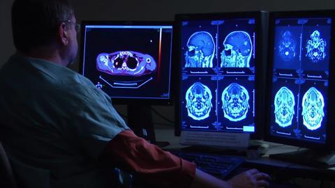 Radiologist Watching Monitors Of Brain 2