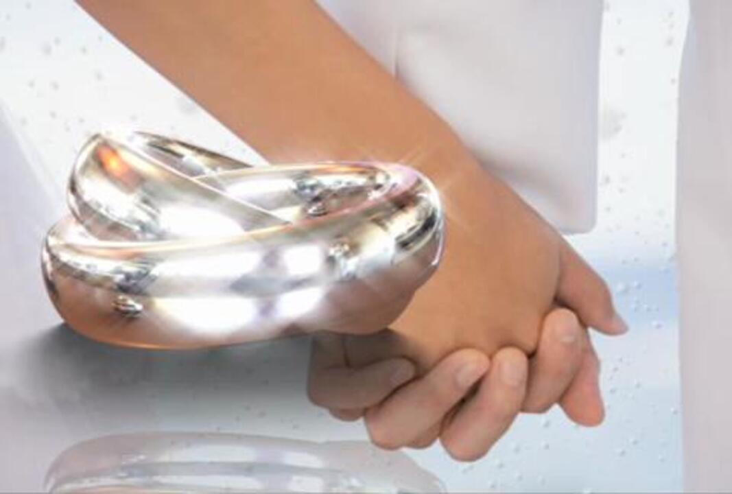 Wedding Rings Interlocked Hands