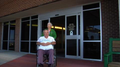 Patient Leaving Hospital In Wheelchair