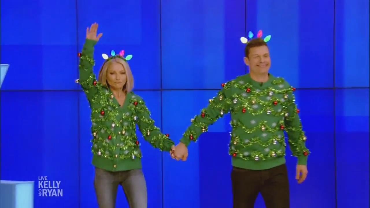 Tipsy Elves Naughty or Nice Ugly Christmas Sweater worn by Ryan Seacrest as  seen in LIVE with Kelly and Ryan on December 16, 2022