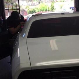Photo of North County Window Tinting - Vista, CA, US. Pasting, Cutting and placing the window tint.