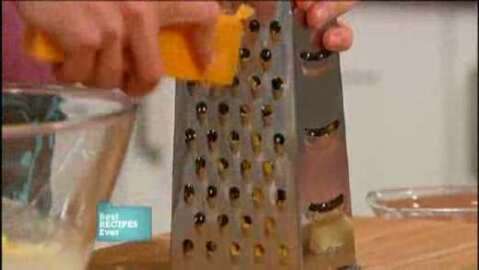 Grating old cheddar cheese