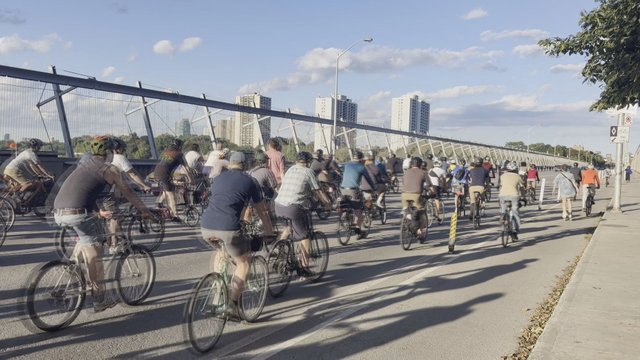Cyclists rally in protest of province's plan to remove bike lanes