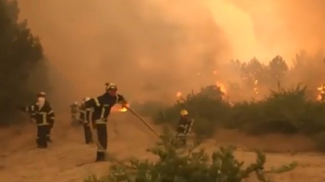 Tens of thousands evacuated as wildfires spread in France and Spain