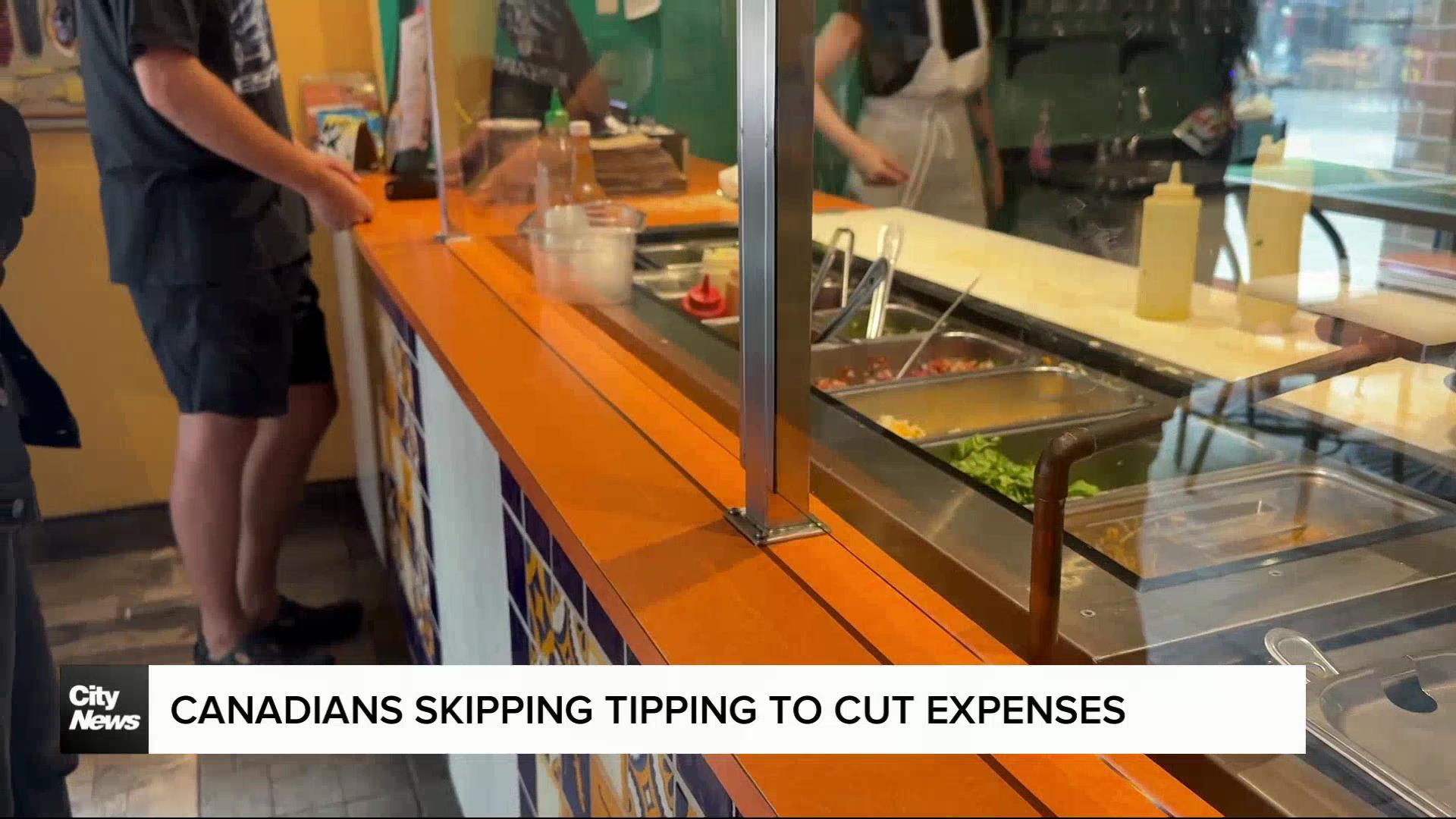 Canadians scaling back on tipping