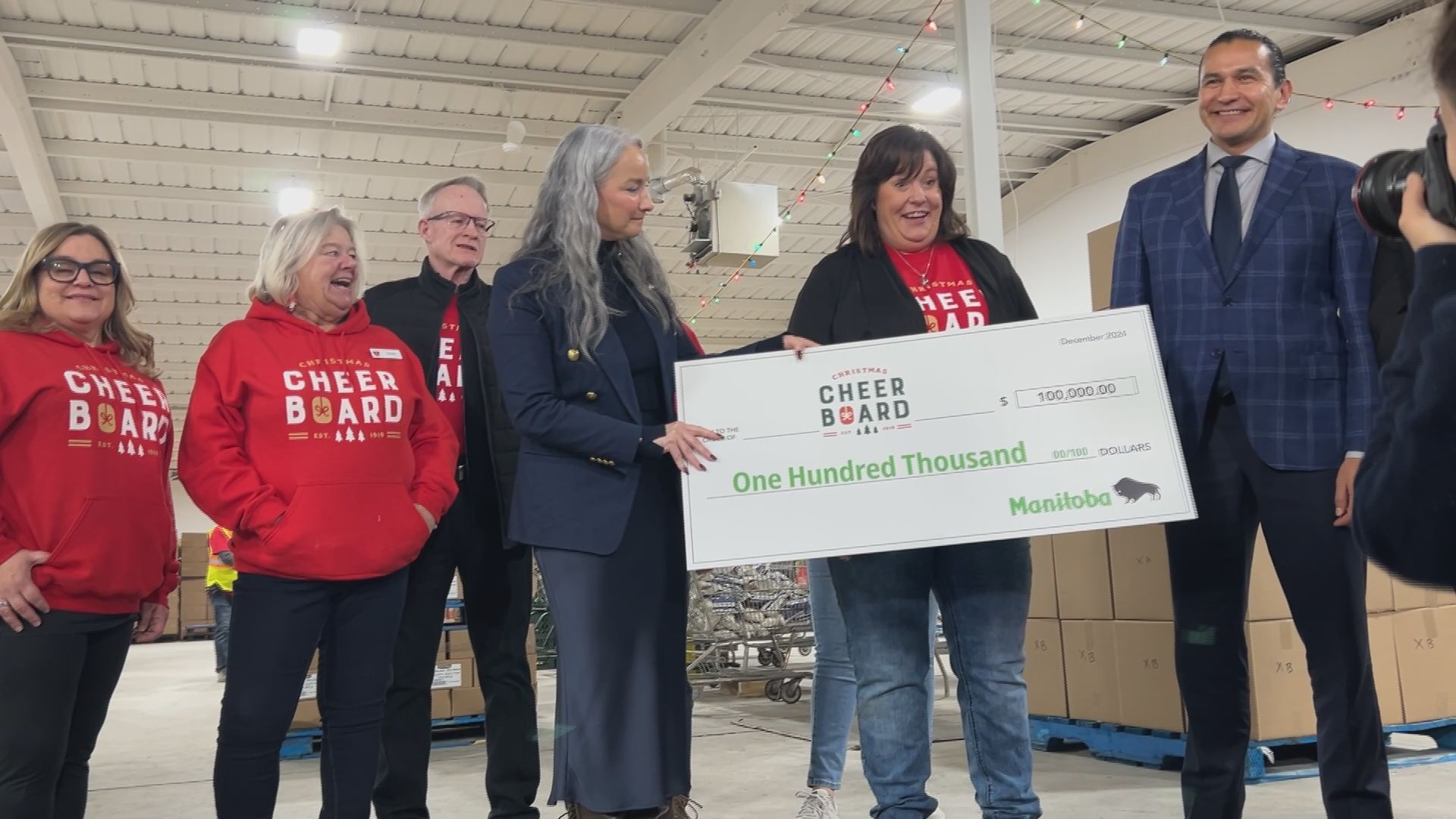 Manitoba government gifts Christmas Cheer Board $100,000 cheque to support families in need