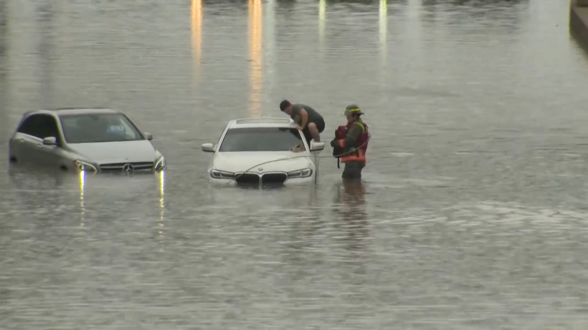 ON CAM: Drivers rescued from stranded cars on flooded DVP