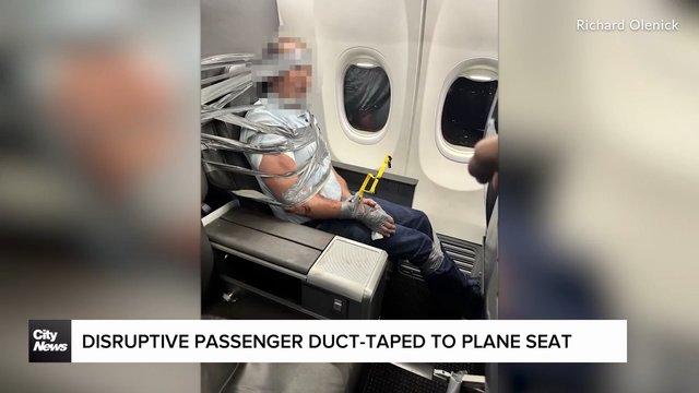 Disruptive passenger duct-taped to plane seat