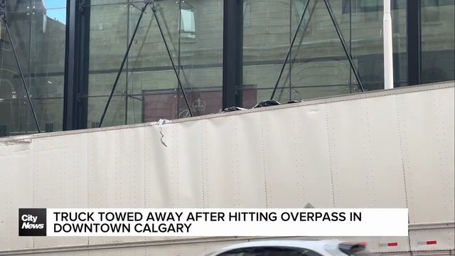 Truck towed away after hitting overpass in downtown Calgary