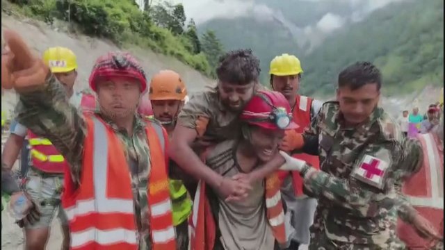 2 men trapped beneath Nepal hydropower tunnel pulled out alive nine days after floods