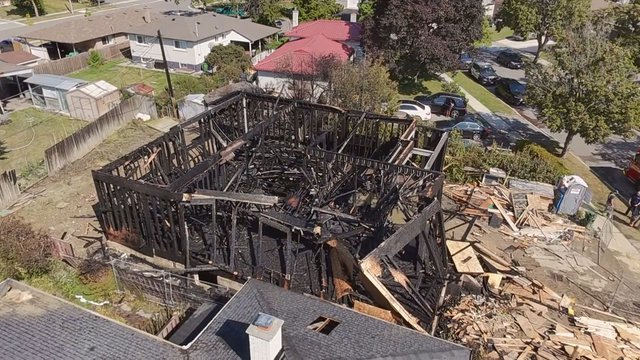 Fire rips through home under construction: 'The whole house collapsed!'