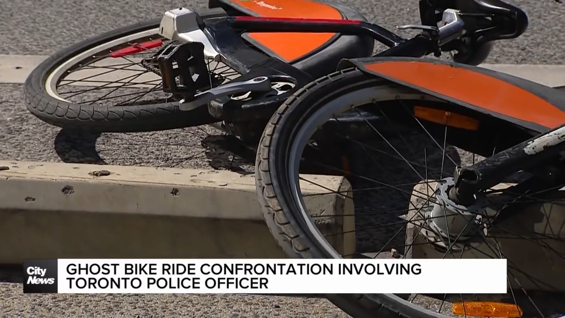 Heated exchange between cyclists and Toronto Police officer during ghost bike ride