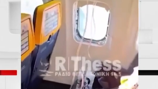 Passenger partly sucked out of broken plane window