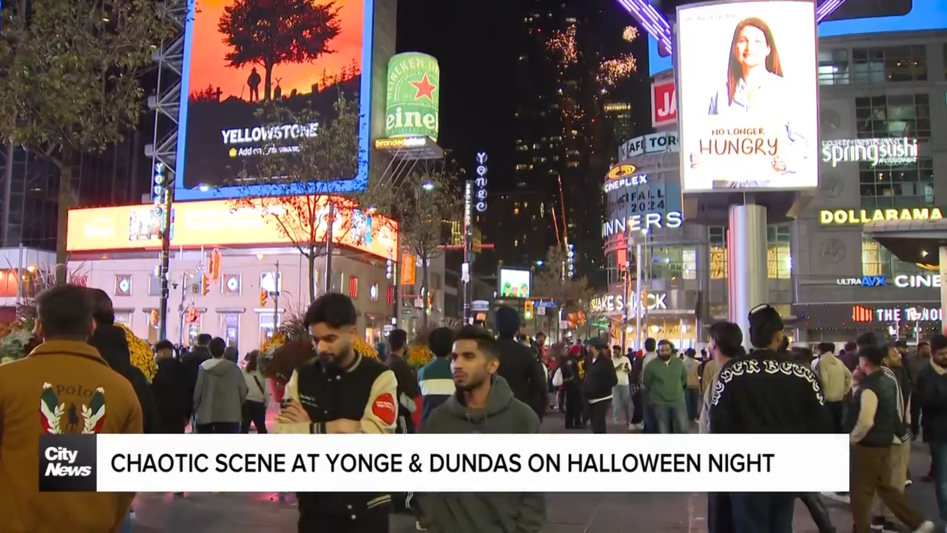 Chaotic scene at Yonge and Dundas as fireworks and vehicles flood the intersection