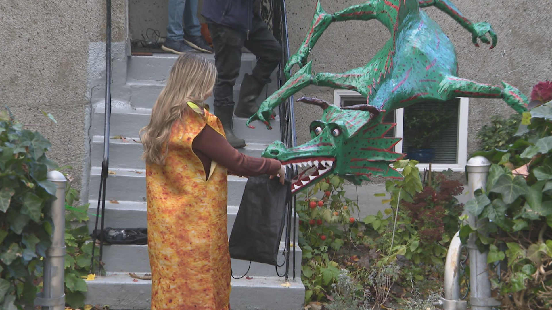 Dragon helping to hand out candy on Halloween in Vancouver