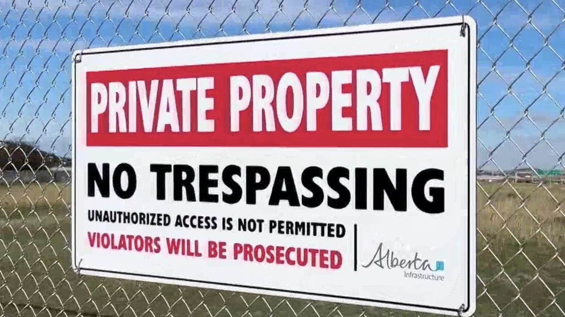 Popular greenspace in NW Calgary hit with locked fence, no trespassing signs