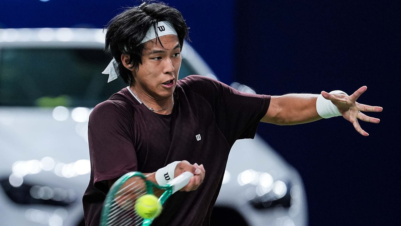 Hot Shot: Zhou, on the tie-break charge, holds firm at the net in Shanghai