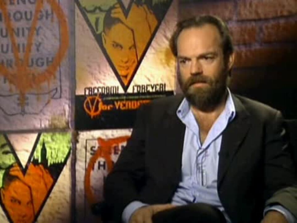 Hugo Weaving speaks to a TV reporter upon his arrival for the Tokyo premier  of his latest film V for Vendetta Monday, April 17, 2006. The political  action thriller, that stars Weaving