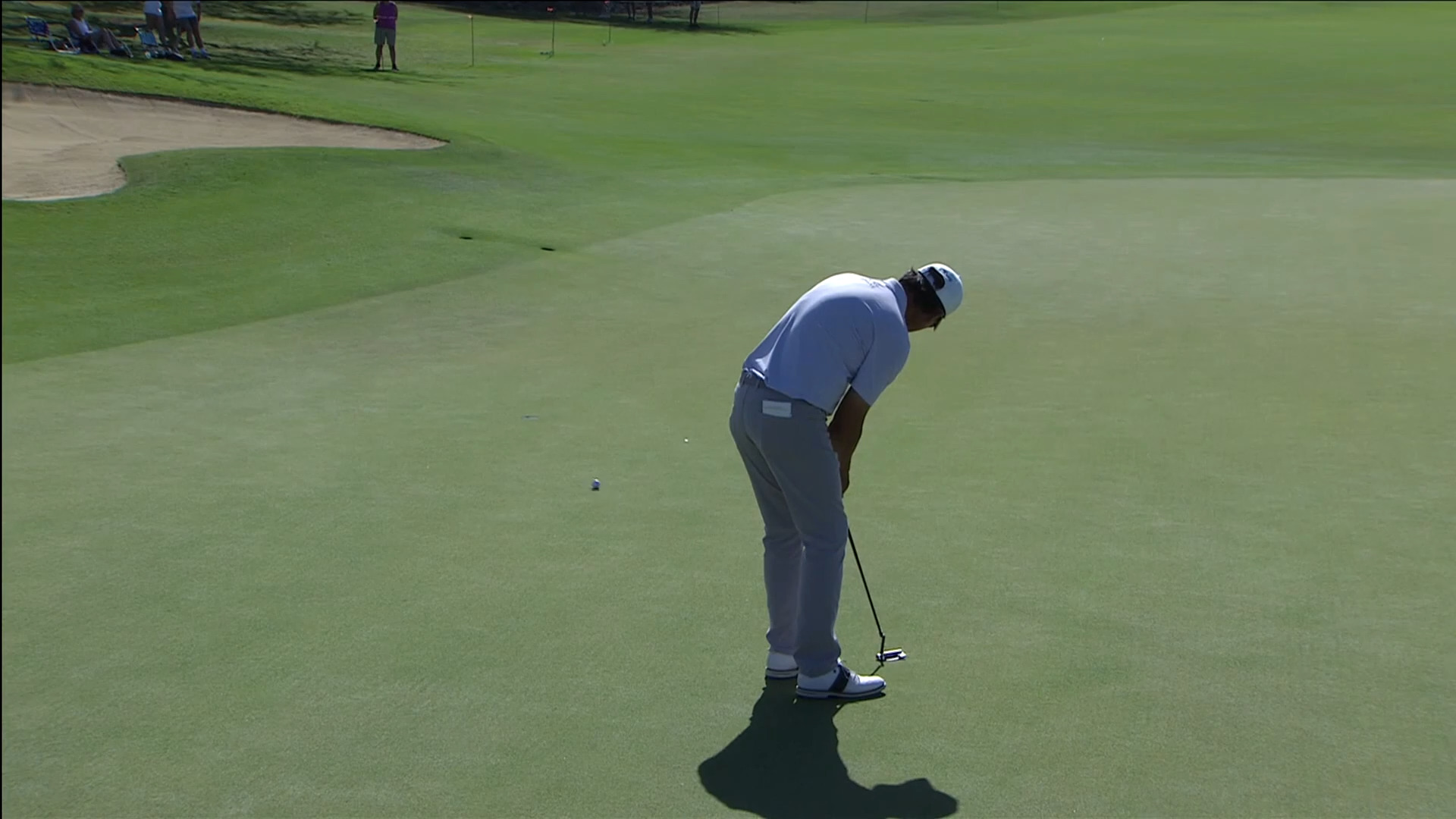 Ken Tanigawa curls in a nice putt for birdie at Mitsubishi
