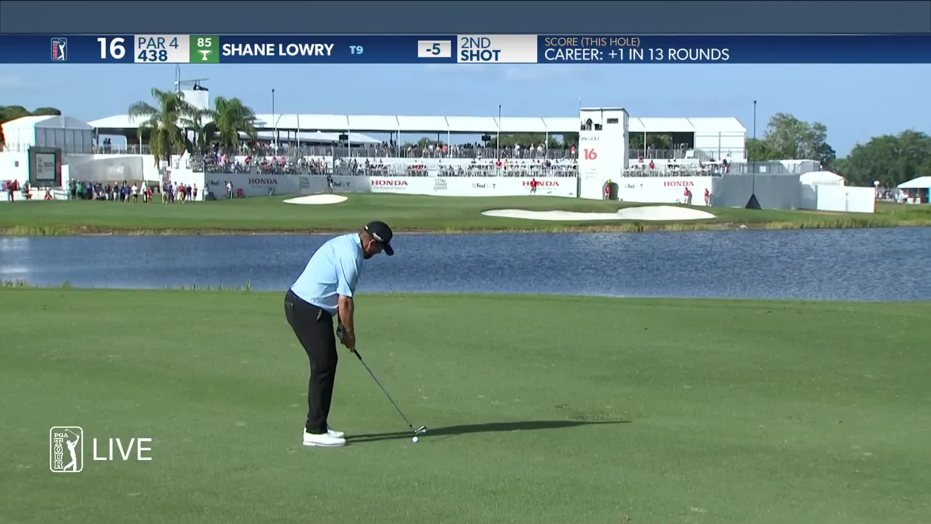 Shane Lowry stays dry and putts for birdie on No