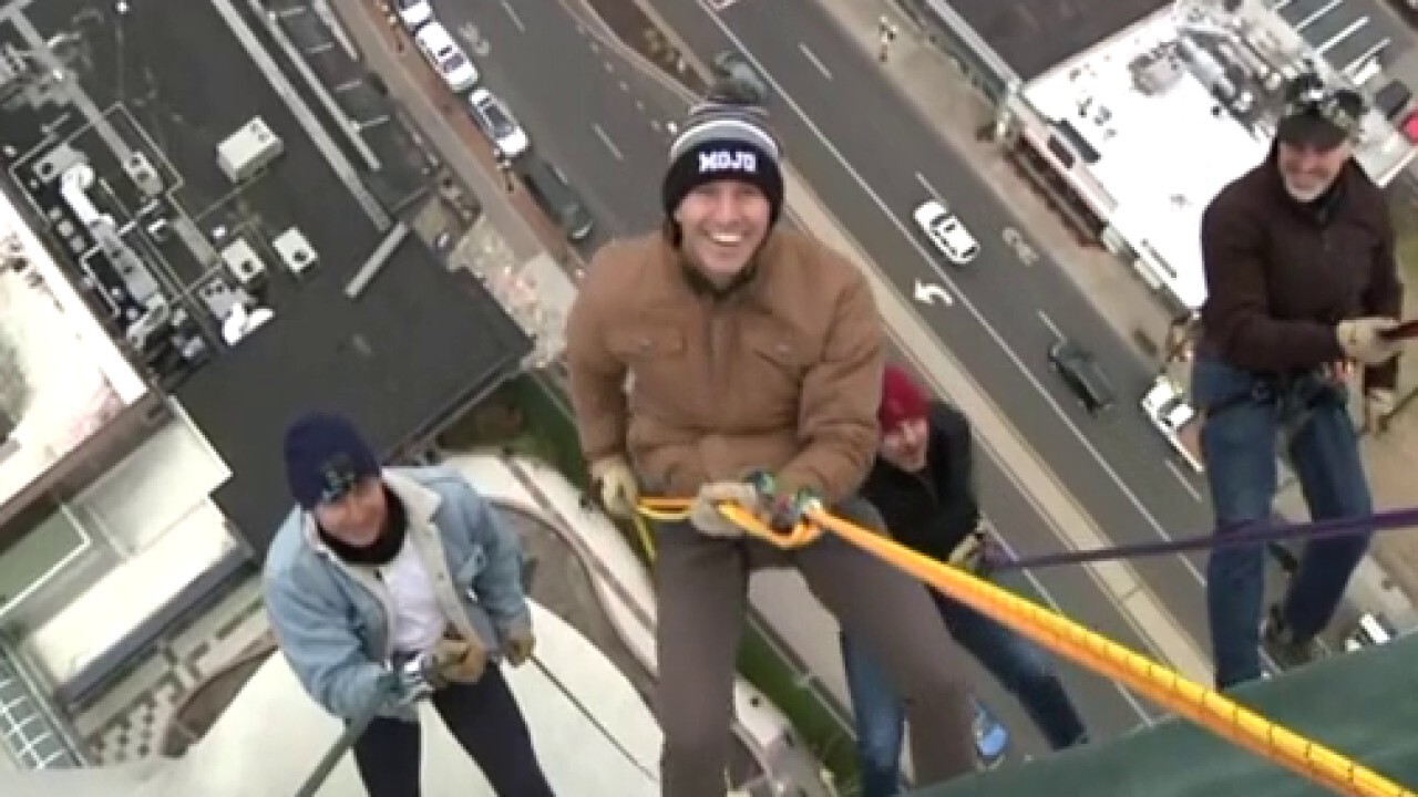 Will Cain rappels from one of the tallest buildings in Connecticut